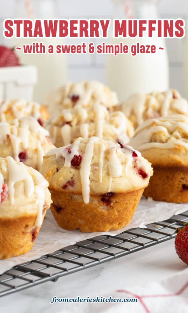 Glazed strawberry muffins on a wire rack on a kitchen counter with text.