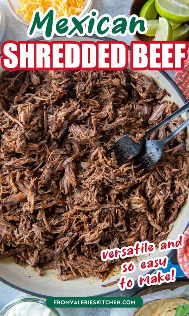 Mexican shredded beef in a blue skillet with text overlay.