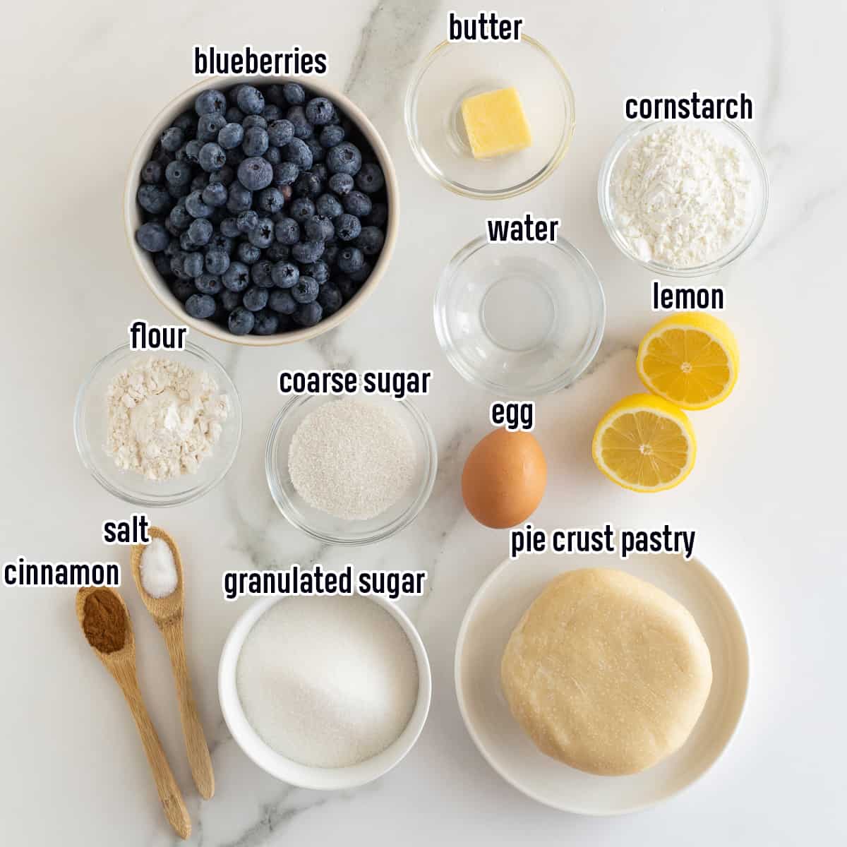 Blueberries, pie crust pastry and other ingredients in bowls with text.