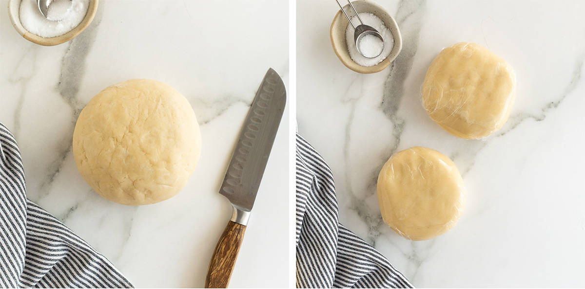 A chef's knife lying next to a ball of pie pastry dough and the dough after it has been cut in half and flattened into discs.