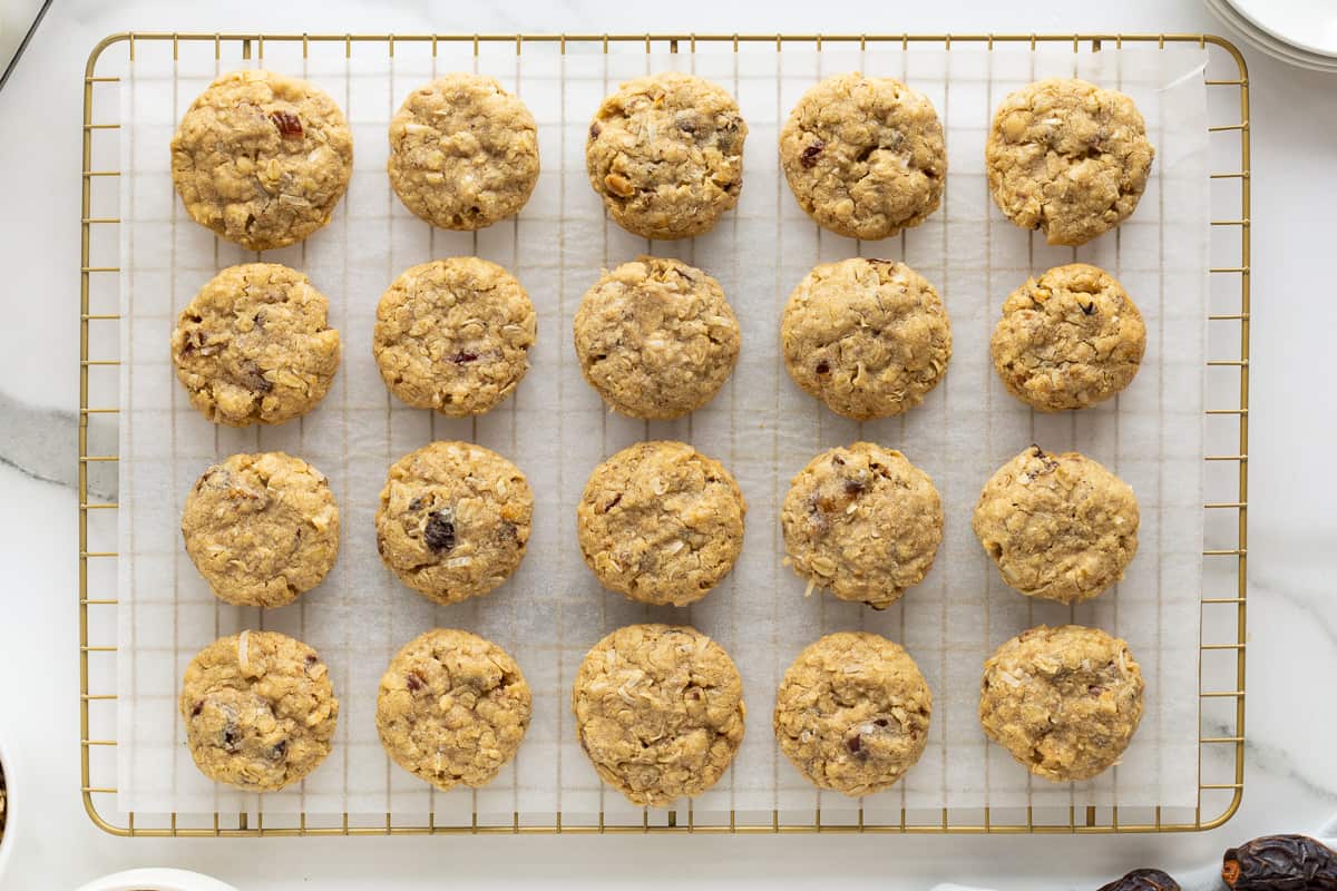 A top down shot of cookies cooling on a wire rack.