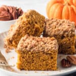 Three slices of pumpkin crumb cake on a white plate.