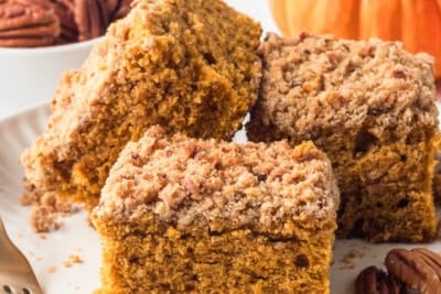 Three slices of pumpkin crumb cake on a white plate.