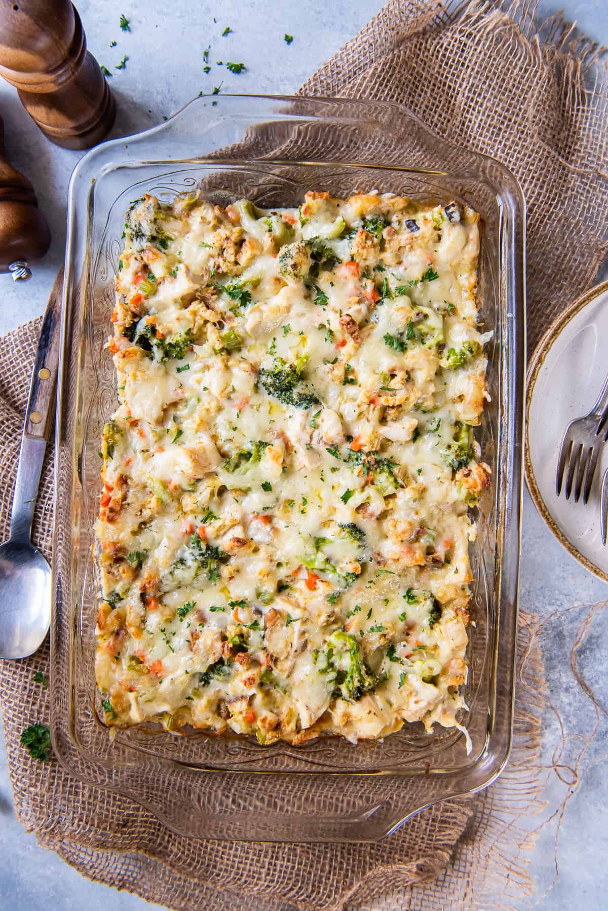 A top down shot of chicken stuffing bake with broccoli and swiss cheese in a baking dish.