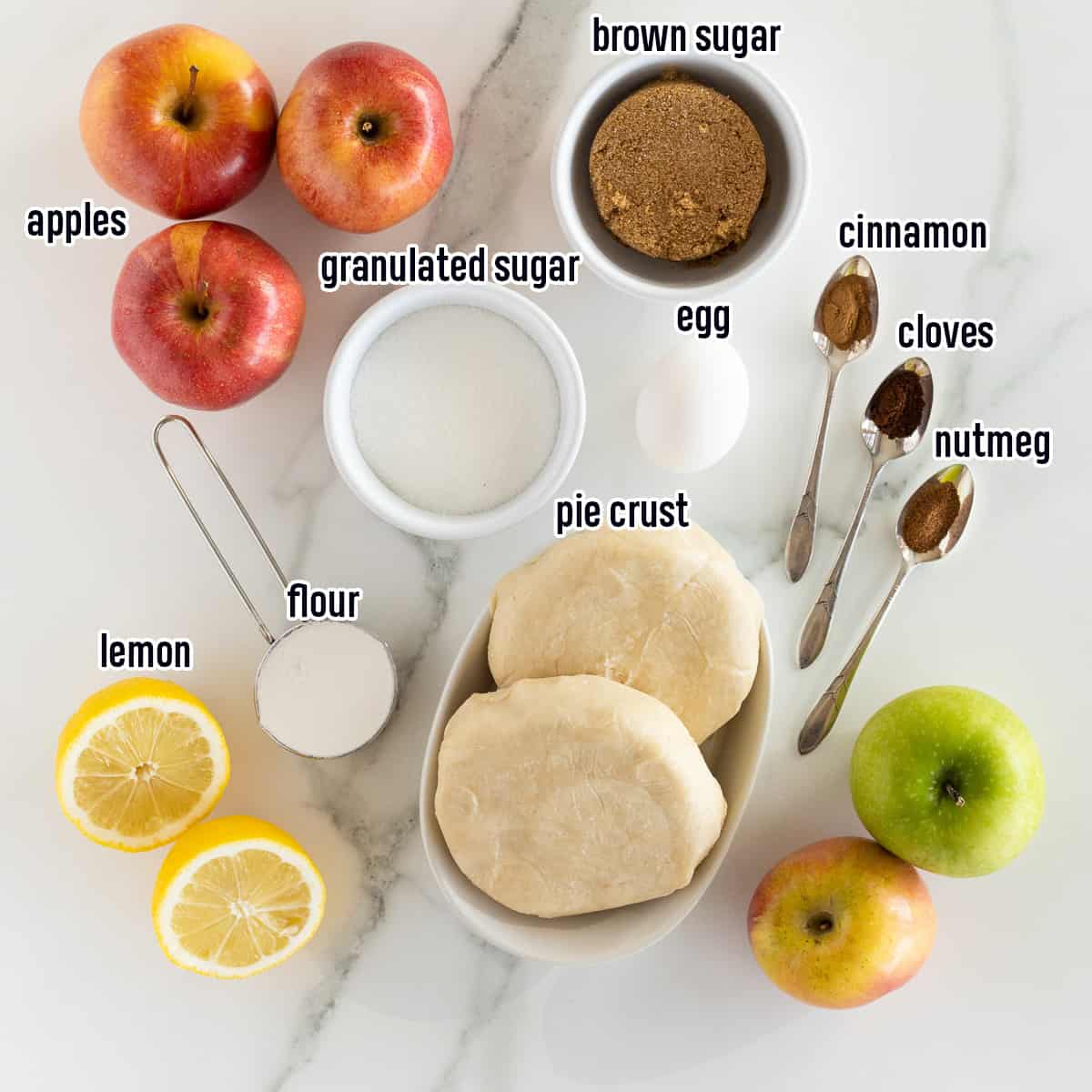 Apples, brown sugar, pie crust and other apple pie ingredients with text.