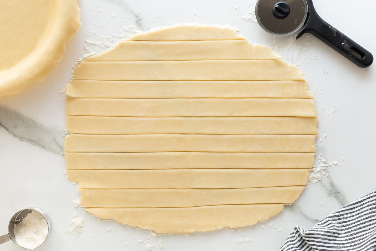 Food processor pie crust pastry cut into strips for a lattice crust.