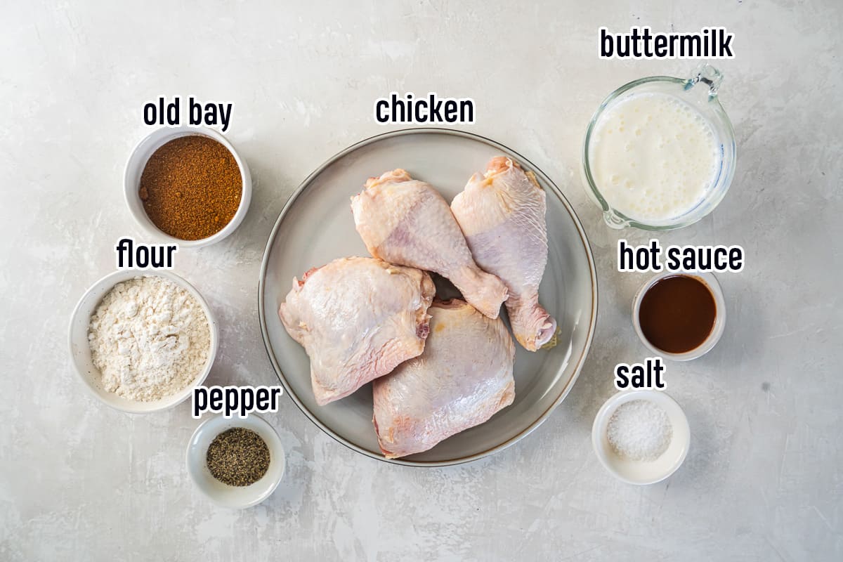 Chicken, buttermilk, old bay seasoning and other ingredients in bowls with text.