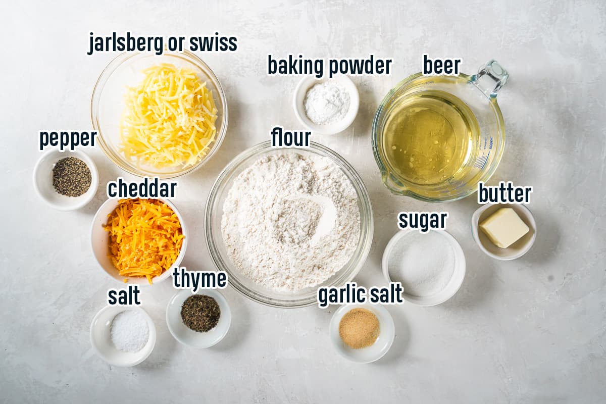 Flour, beer, cheese, and other ingredients in bowls with text.