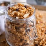 A glass jar filled with granola.