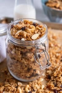 A glass jar filled with granola.