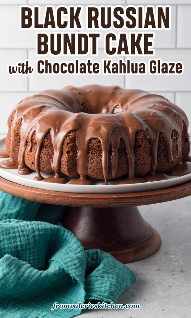 Glaze dripping down the sides of a black russian bundt cake on a cake stand with text.