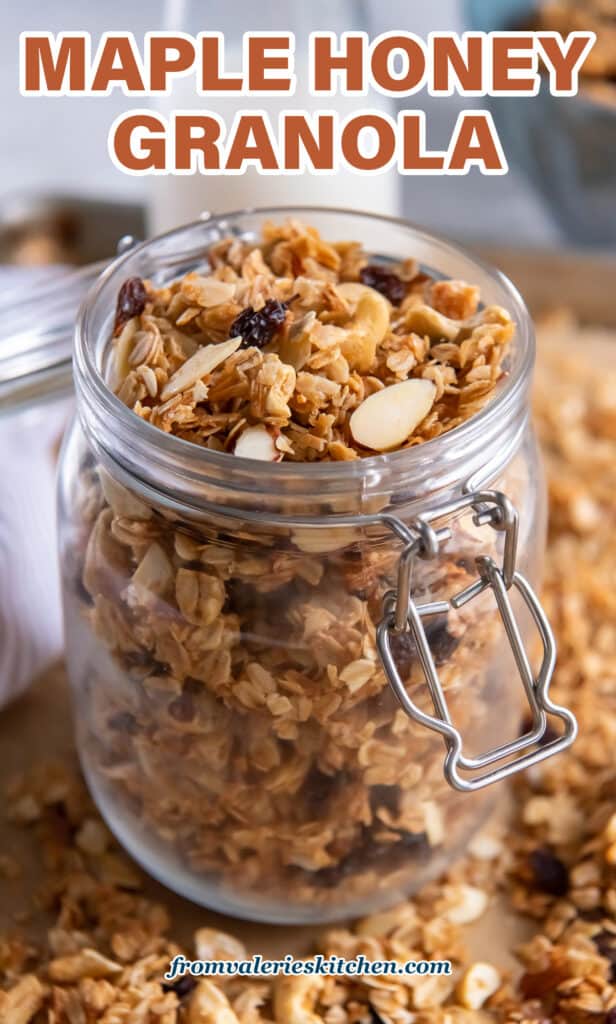 A glass jar filled with maple honey granola with text.