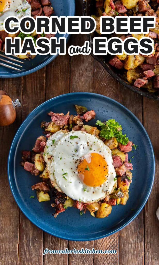 Corned beef hash on blue plates topped with fried eggs with text.