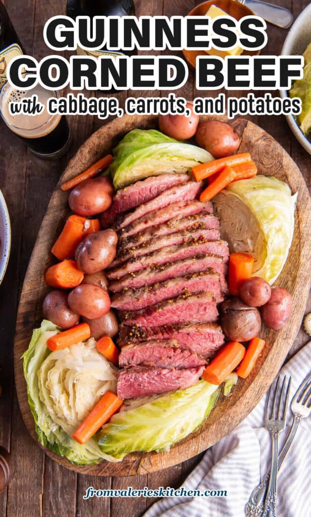 Sliced corned beef, cabbage, carrots, and potatoes on a wood platter with text.
