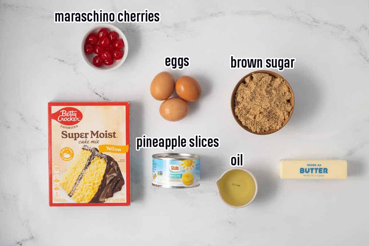 Yellow cake mix, maraschino cherries, canned pineapple and other ingredients with text.