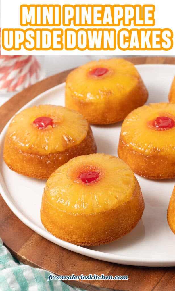 Mini pineapple upside down cakes on a white plate with text.