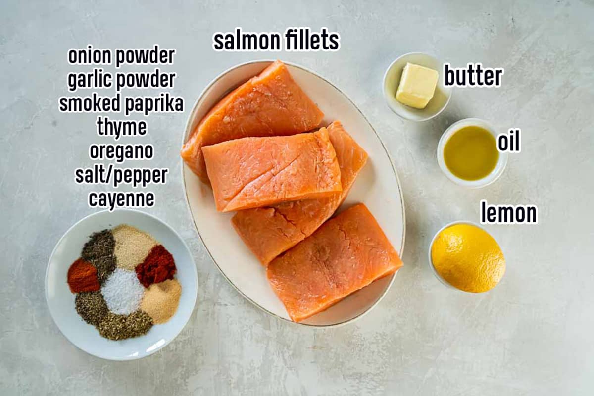 Salmon fillets, butter, oil, lemon, and a plate with spices with text.