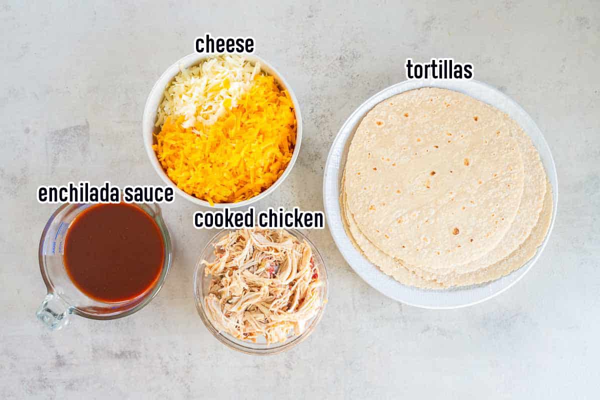Tortillas, cooked chicken, shredded cheese, and red enchilada sauce in bowls with text.
