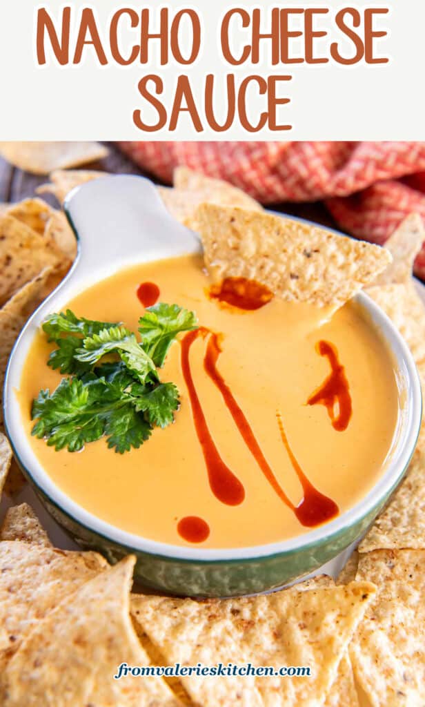 A tortilla chip dipping into a small dish of nacho cheese sauce with text.