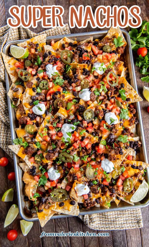 Nachos with ground beef on a baking sheet with text.