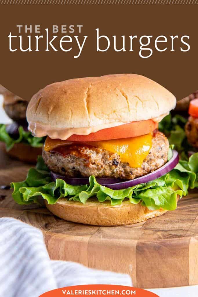 A turkey burger with cheese, lettuce, and tomato on a bun on a white plate with text overlay.