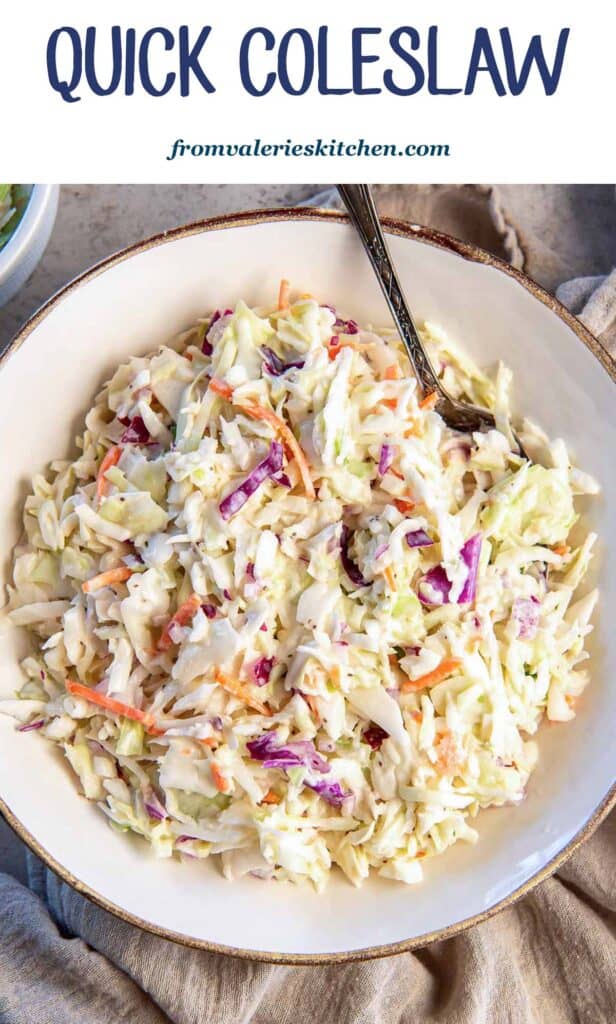 Coleslaw in a bowl with a spoon with text.