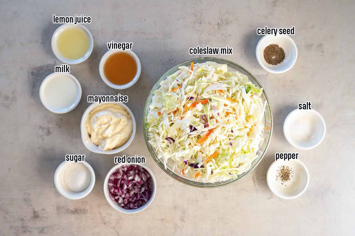 Coleslaw mix in a large bowl surrounded by smaller bowls of ingredients with text.