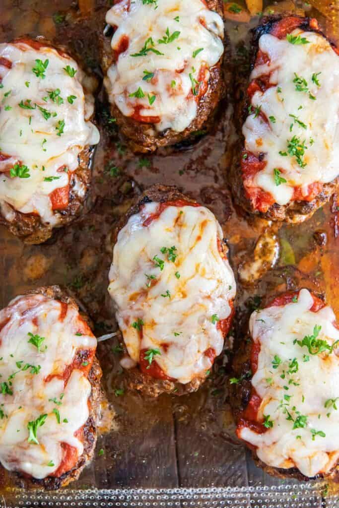 Italian hamburger steaks in a baking dish.