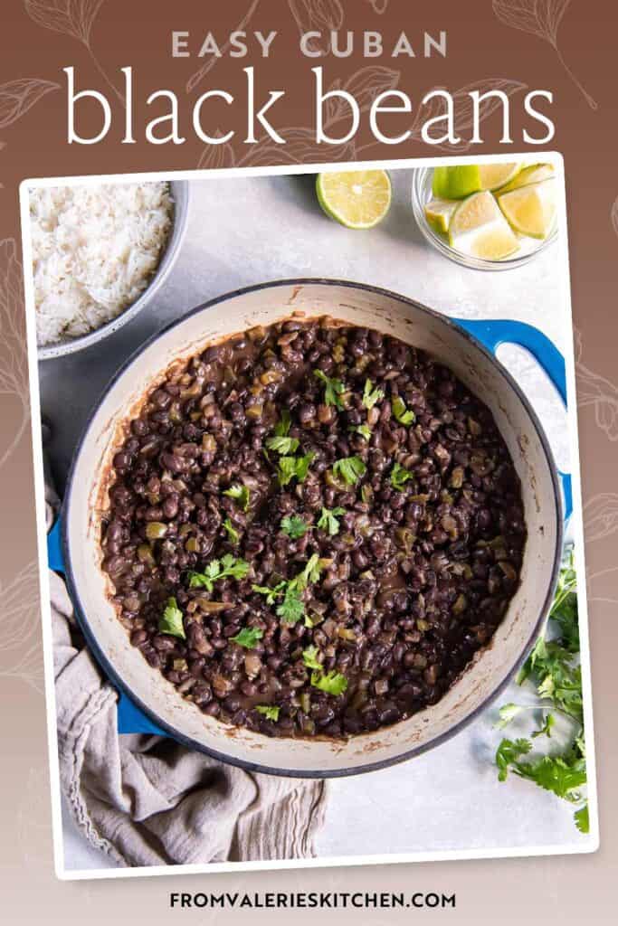 Cuban black beans in a skillet next to a bowl of rice and lime wedges with text overlay.
