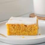 A slice of yam cake on a white plate.