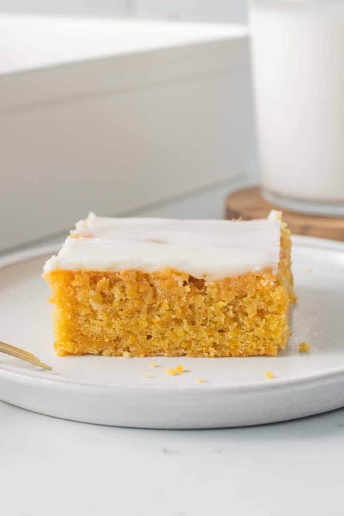 A slice of yam cake on a white plate.