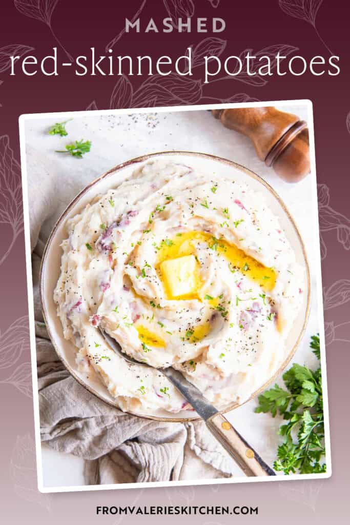 Red skinned mashed potatoes topped with butter in a white bowl with text overlay.