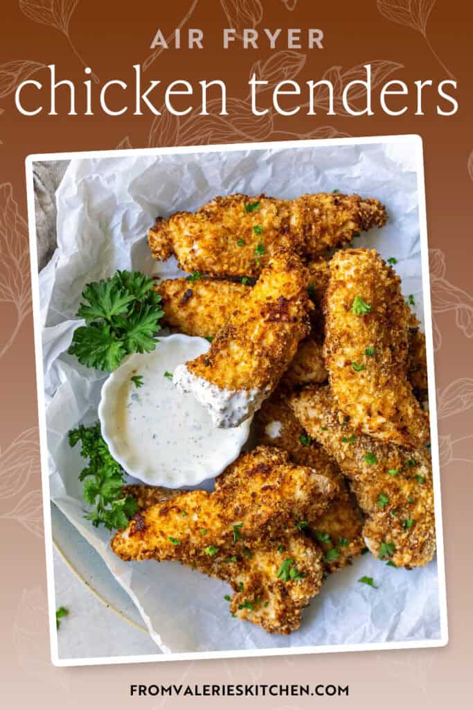 A pile of air fried chicken tenders with a small bowl of Ranch dressing with text overlay.