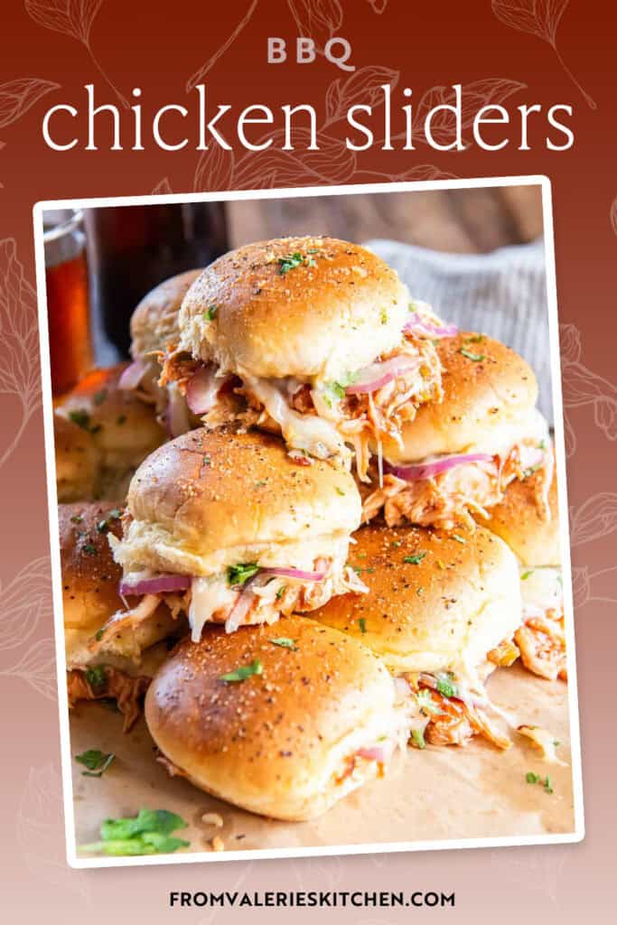 A stack of BBQ chicken sliders on parchment paper with text overlay.