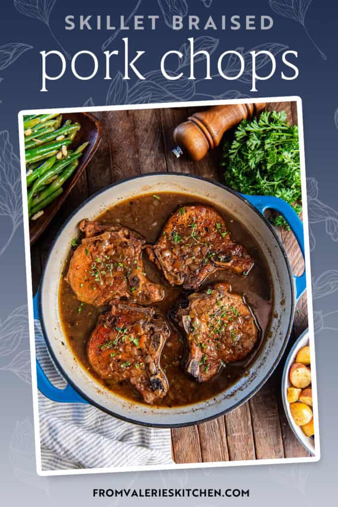 Four pork chops in a skillet with braising liquid with text overlay.