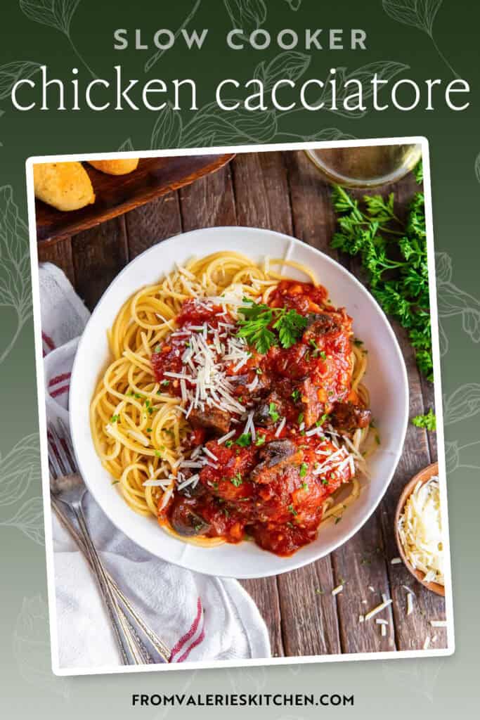 Chicken cacciatore with pasta in a white bowl next to bread sticks and a glass of wine with text overlay.