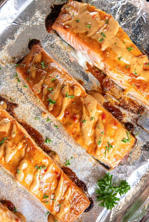Bang bang salmon on a foil lined baking sheet.