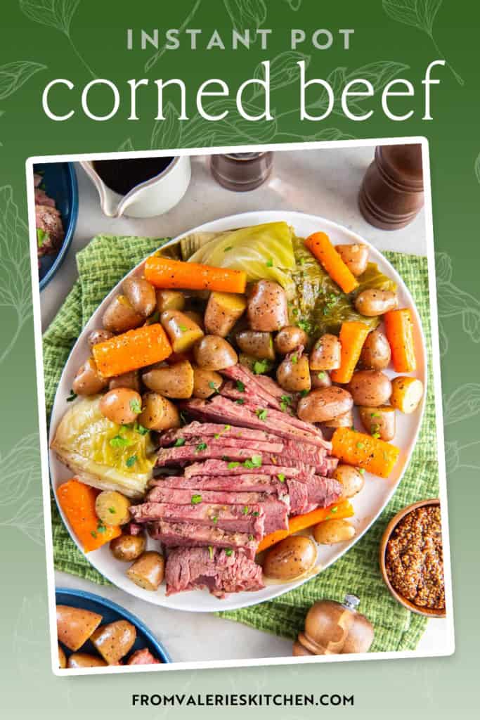 Sliced corned beef on a platter with cabbage, carrots, and potatoes, on a dinner table with text overlay.