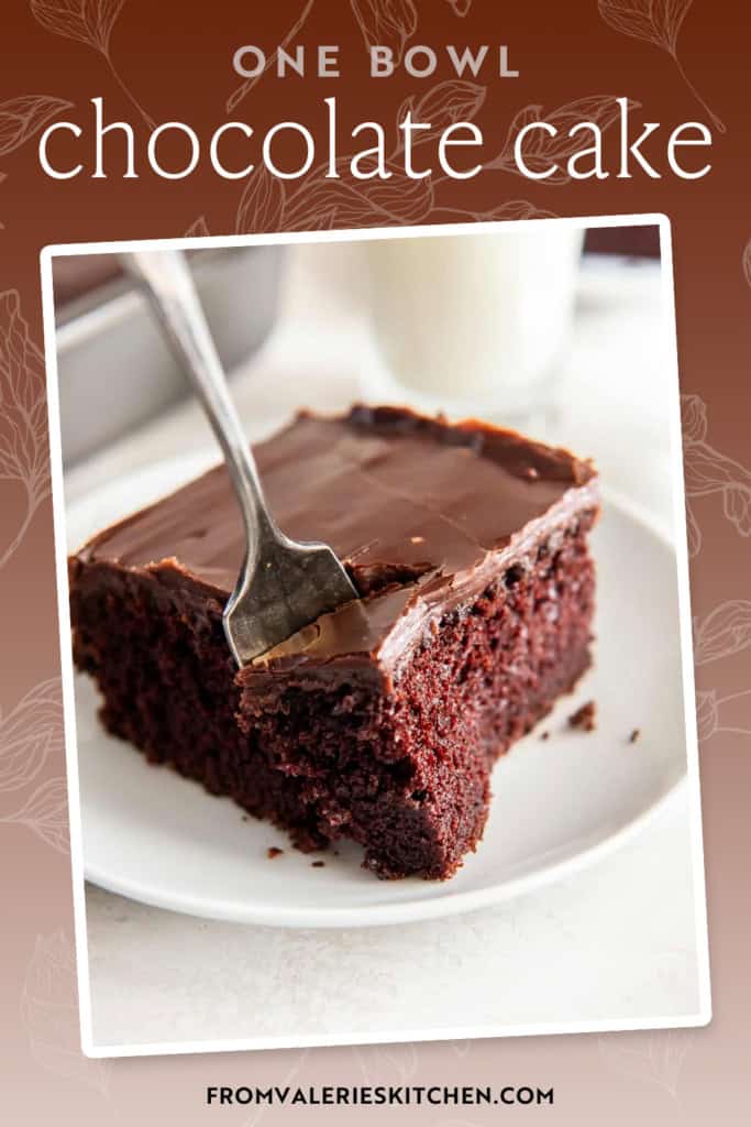 A fork pressing into a slice of chocolate cake on a white plate with text overlay.