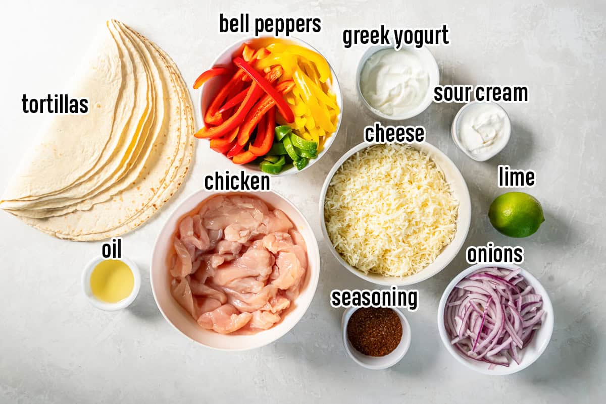 Strips of raw chicken, bell peppers, onions and other ingredients in bowls with text overlay.
