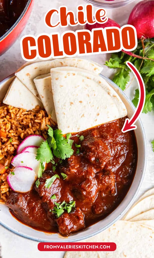 A white bowl filled with rice, chile colorado,and folded flour tortillas garnished with radishes with text overlay.
