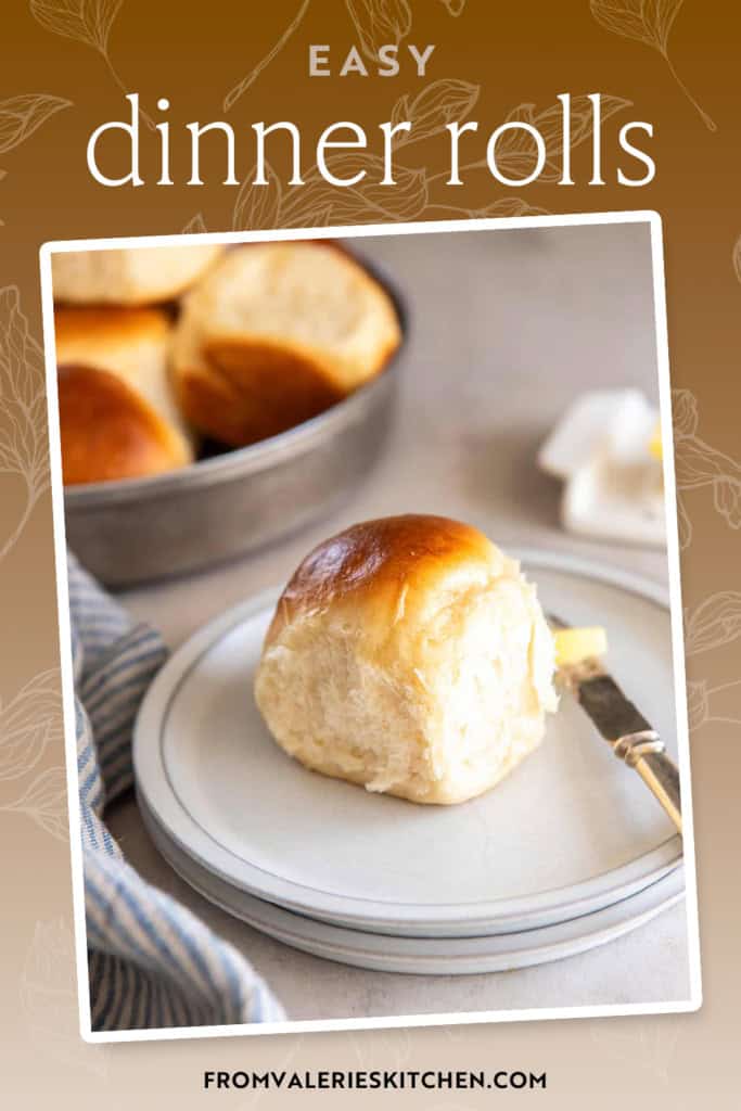 A butter knife resting on a small white plate with a dinner roll with text overlay.