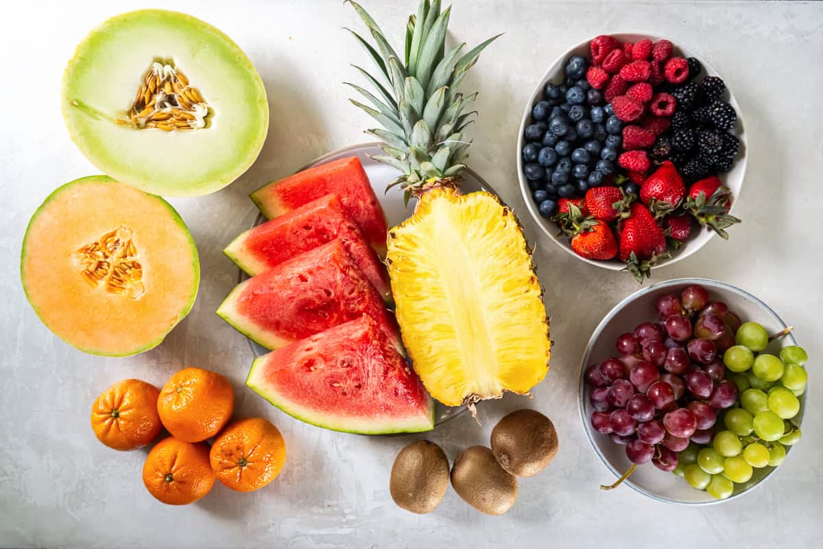 Pineapple, watermelon, berries and other fruit for a fruit platter.