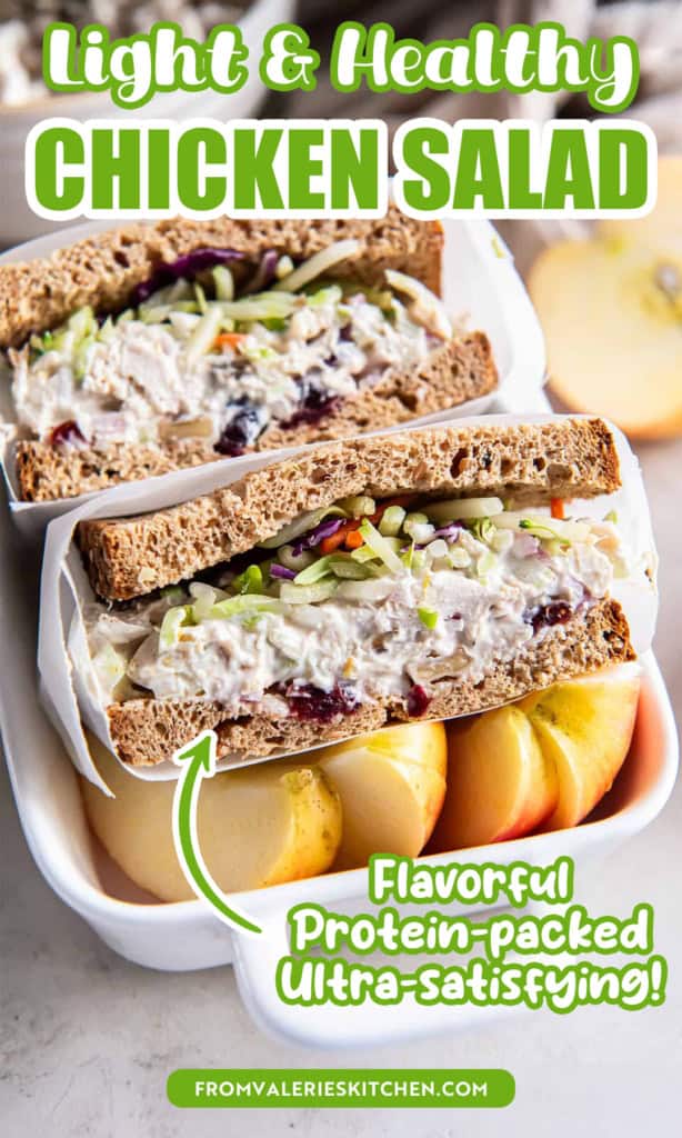 A lightened up chicken saad sandwich on wheat bread sliced in half in small ceramic dish with sliced apple with text overlay.