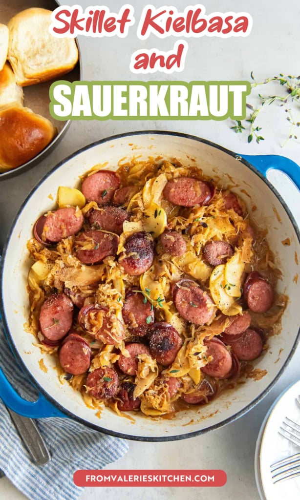 A skillet filled with kielbasa sausage and sauerkraut with text overlay.