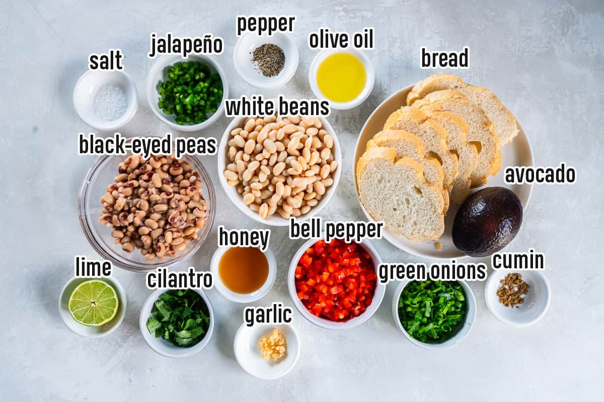 White beans, black eyed peas, bread and other ingredinets in bowls with text overlay.