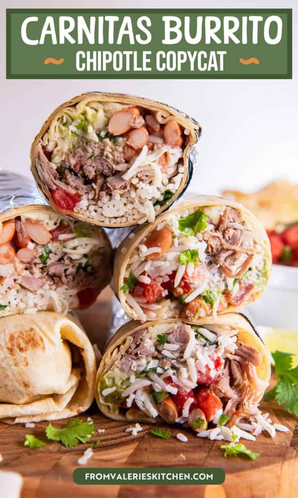 Two carnitas burritos cut in half and stacked on a wooden board, showing layers of shredded pork, rice, beans, guacamole, and salsa with lime wedges and cilantro in the background with text overlay.