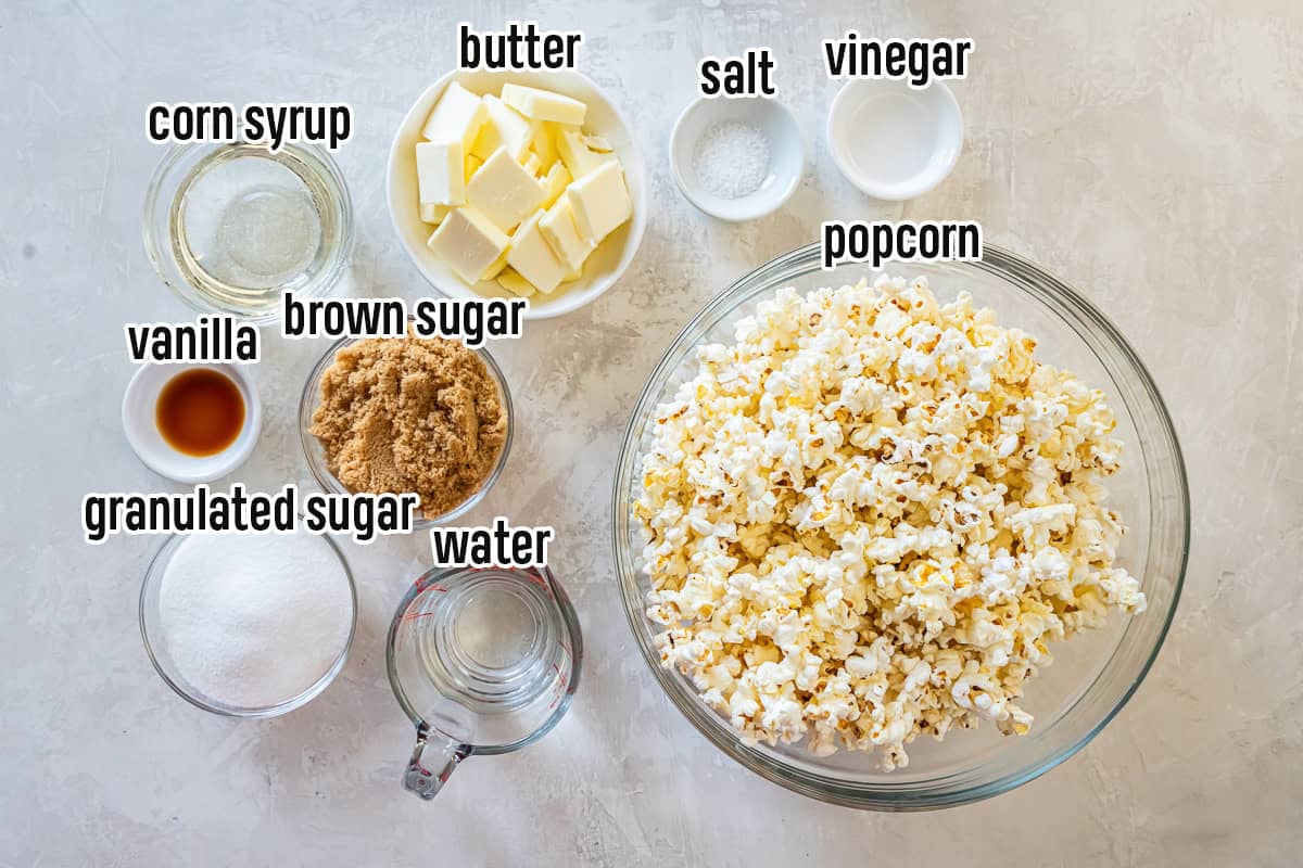 Popcorn, brown sugar, corn syrup and other popcorn ball ingredients in bowls with text overlay.