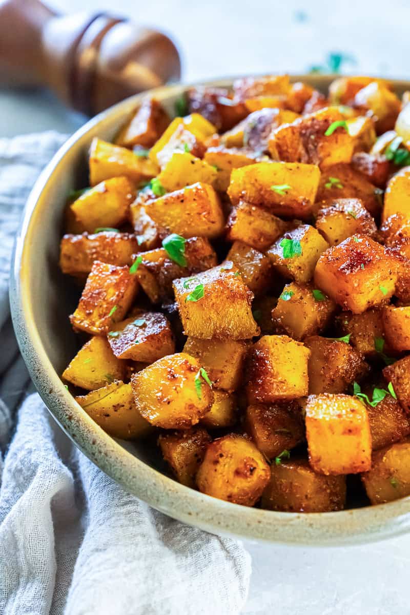 A bowl of roasted butternut squash with spices.