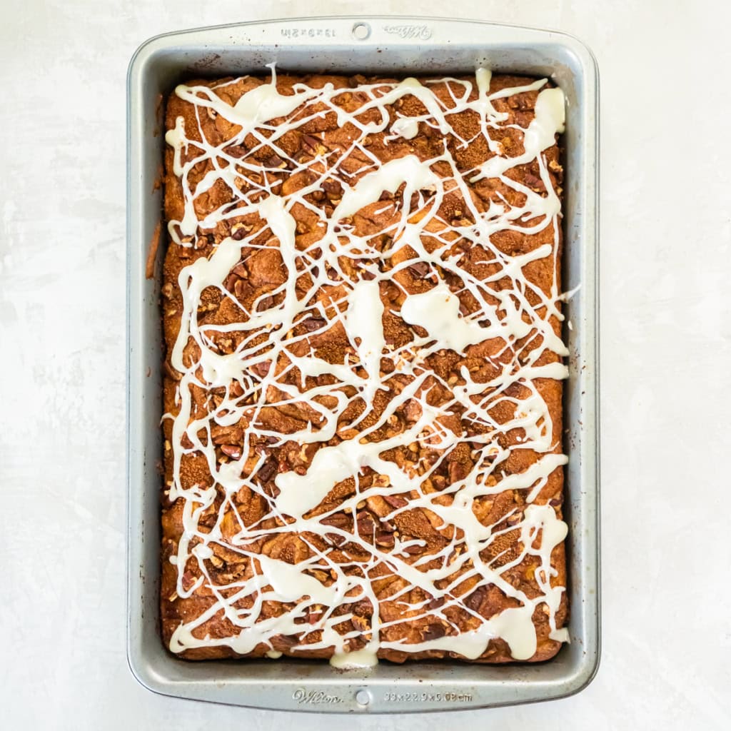 An iced coffee cake in a metal pan.